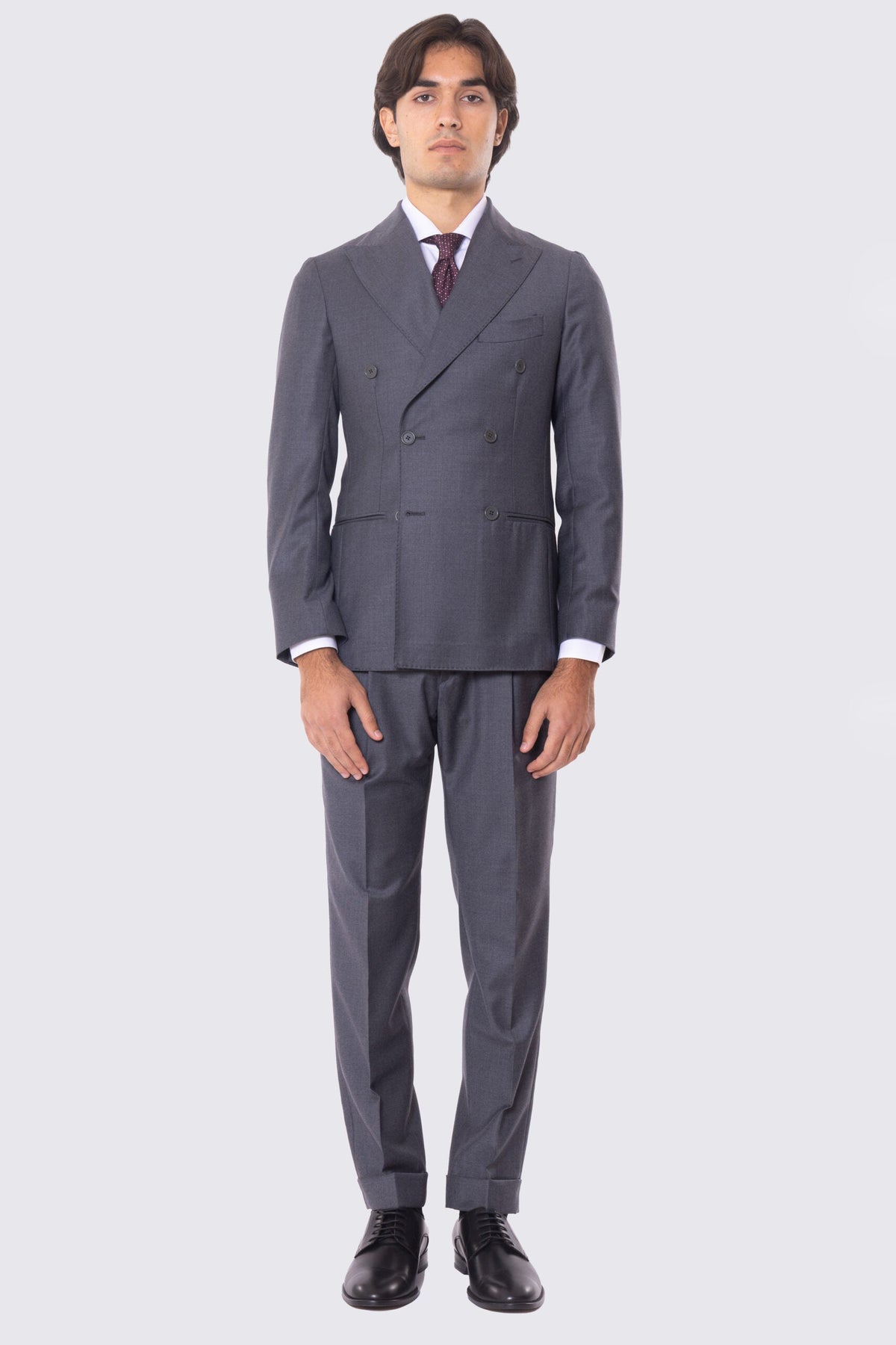Abito grigio con giacca Doppiopetto rever a lancia tasche a filo e pantalone vita alta con doppia pinces e risvolto 5cm 100% lana Flanella Carillo Drapers
