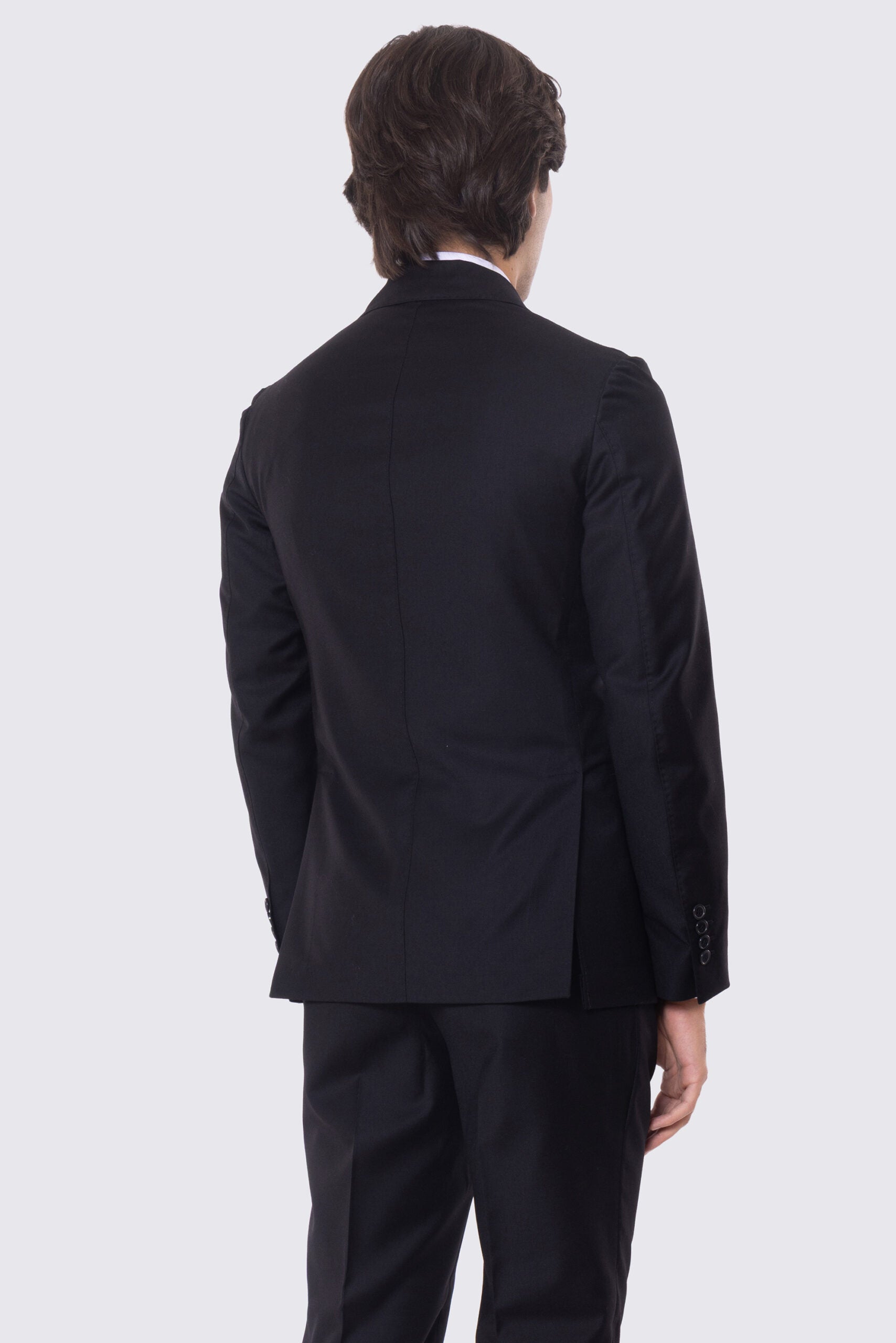 Abito nero con giacca monopetto rever a lancia tasche a filo e pantalone vita alta con fibbie laterali regolabili doppie pinces e risvolto 5cm 100% lana Flanella Carillo Drapers