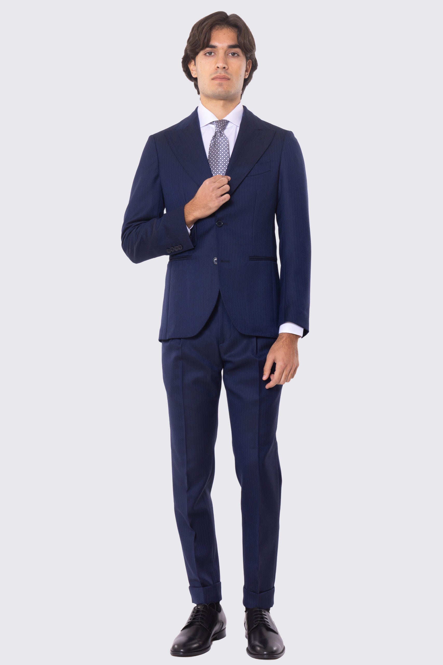 Abito blu spigato con giacca monopetto con rever a lancia e pantalone vita alta con fibbie laterali 100% lana Flanella Holland & Sherry