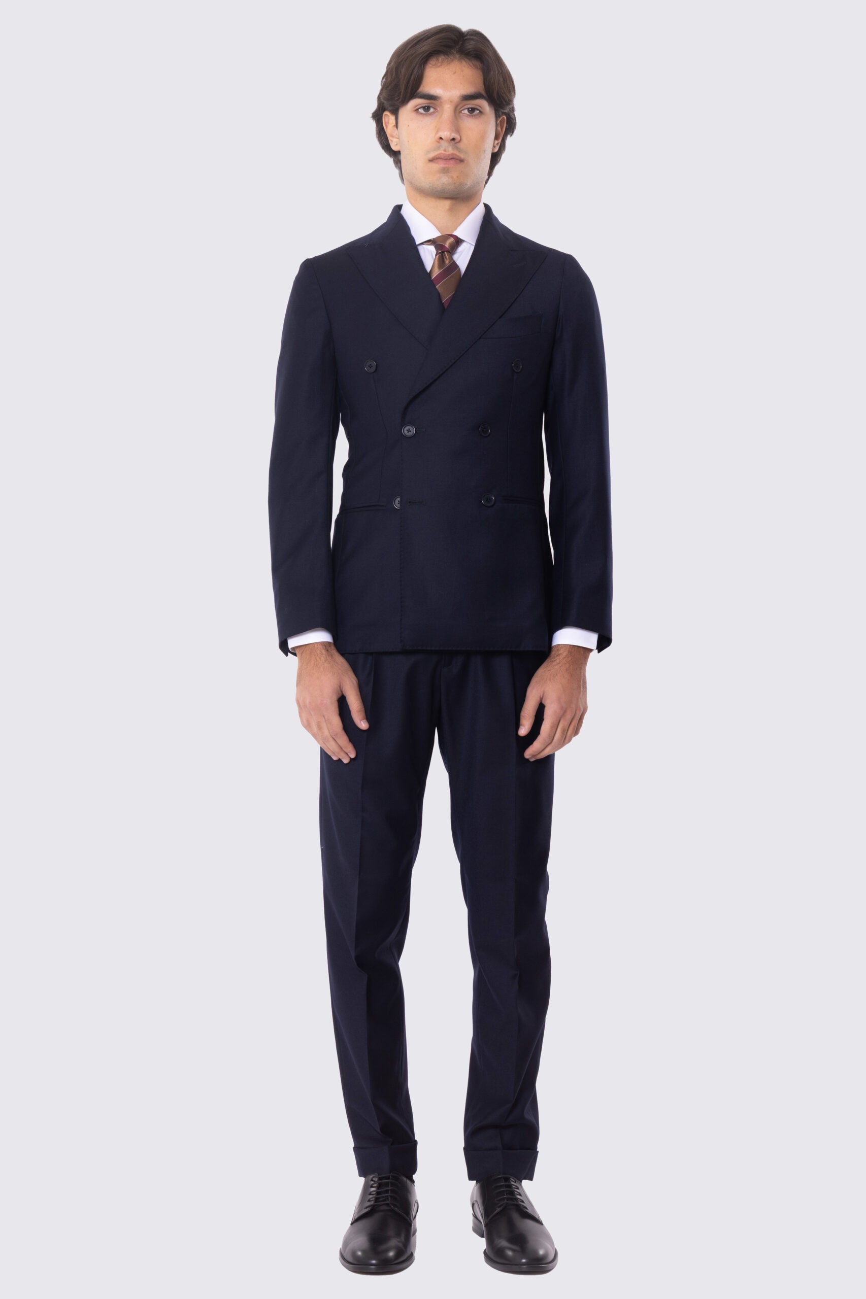 Abito blu notte con giacca Doppiopetto rever a lancia tasche a filo e pantalone vita alta con doppie pinces e risvolto 5cm 100% lana Flanella Carillo Drapers