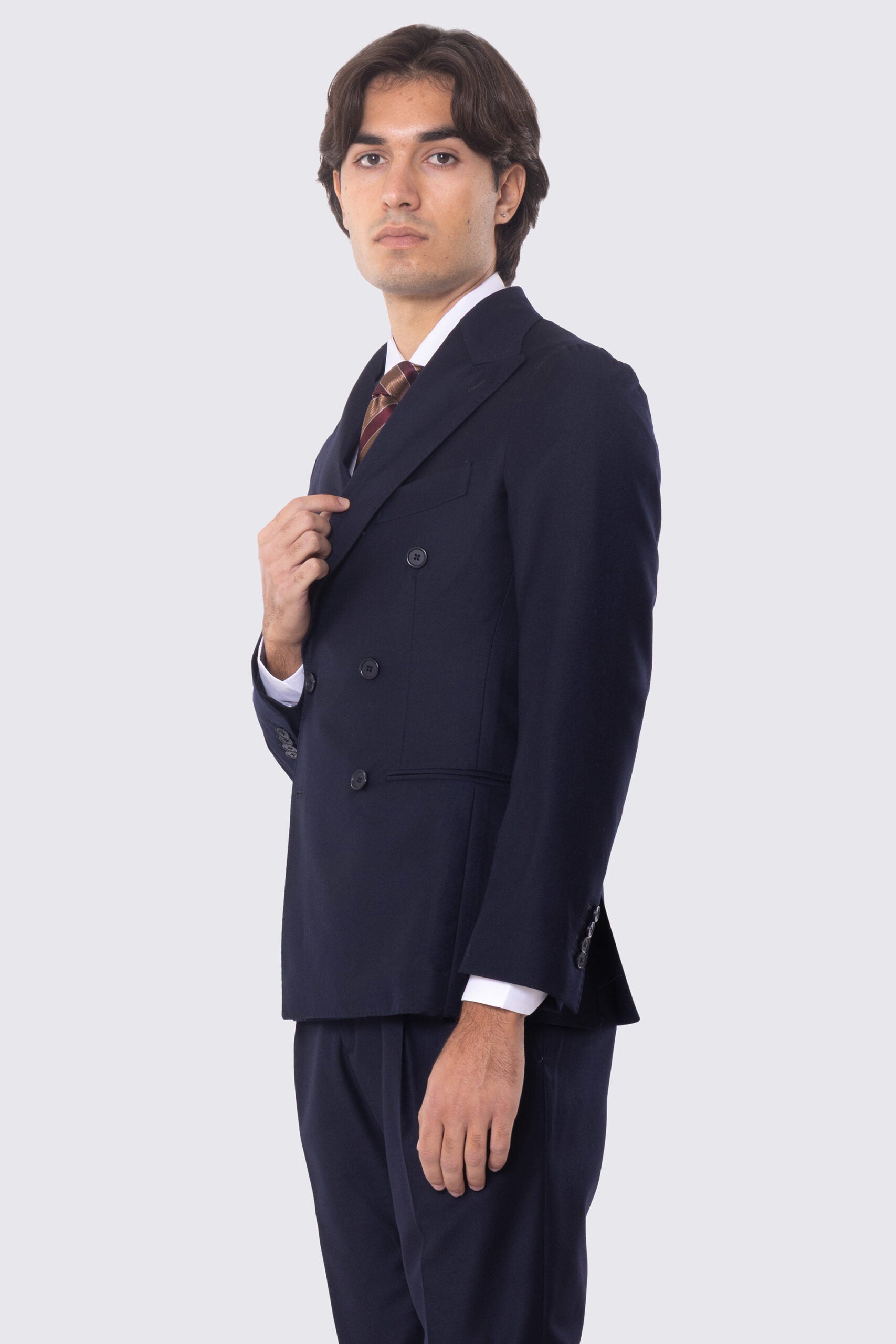 Abito blu notte con giacca Doppiopetto rever a lancia tasche a filo e pantalone vita alta con doppie pinces e risvolto 5cm 100% lana Flanella Carillo Drapers