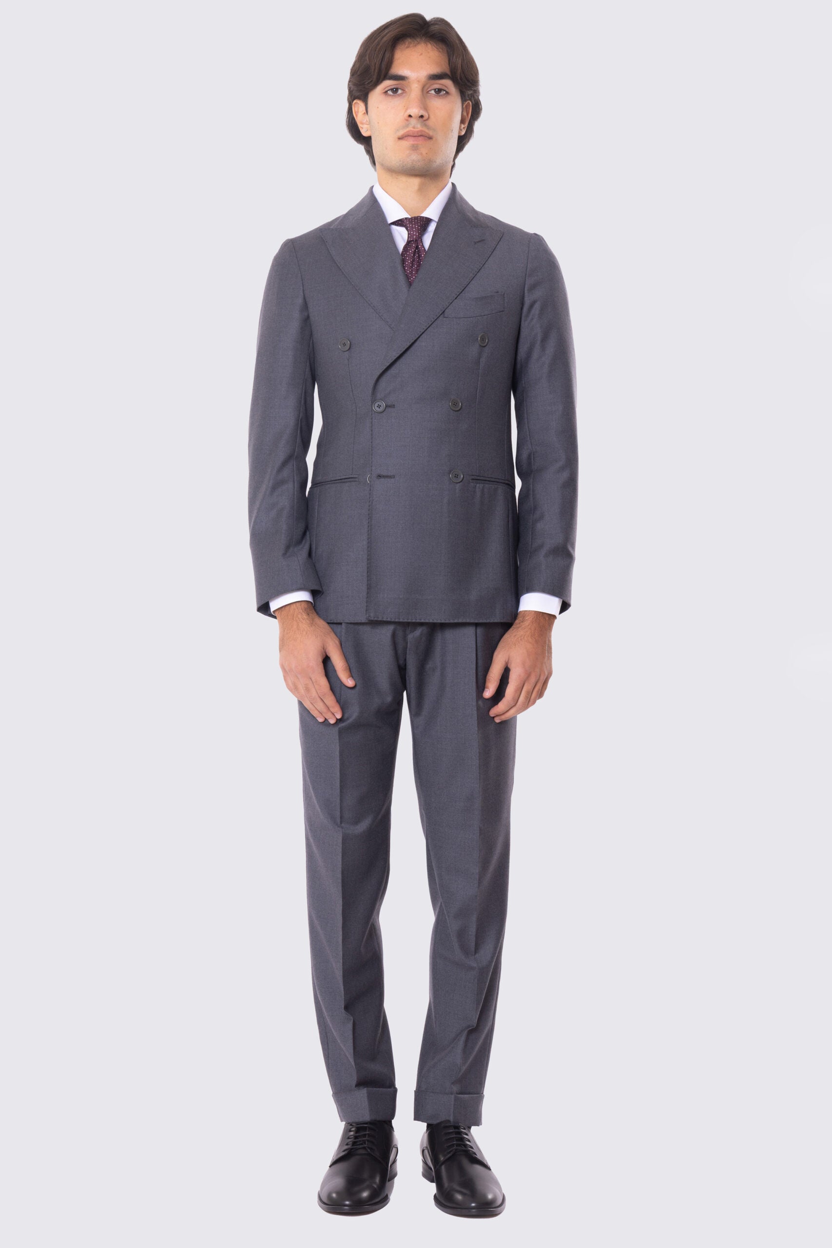 Abito grigio con giacca Doppiopetto rever a lancia tasche a filo e pantalone vita alta con doppia pinces e risvolto 5cm 100% lana Flanella Carillo Drapers