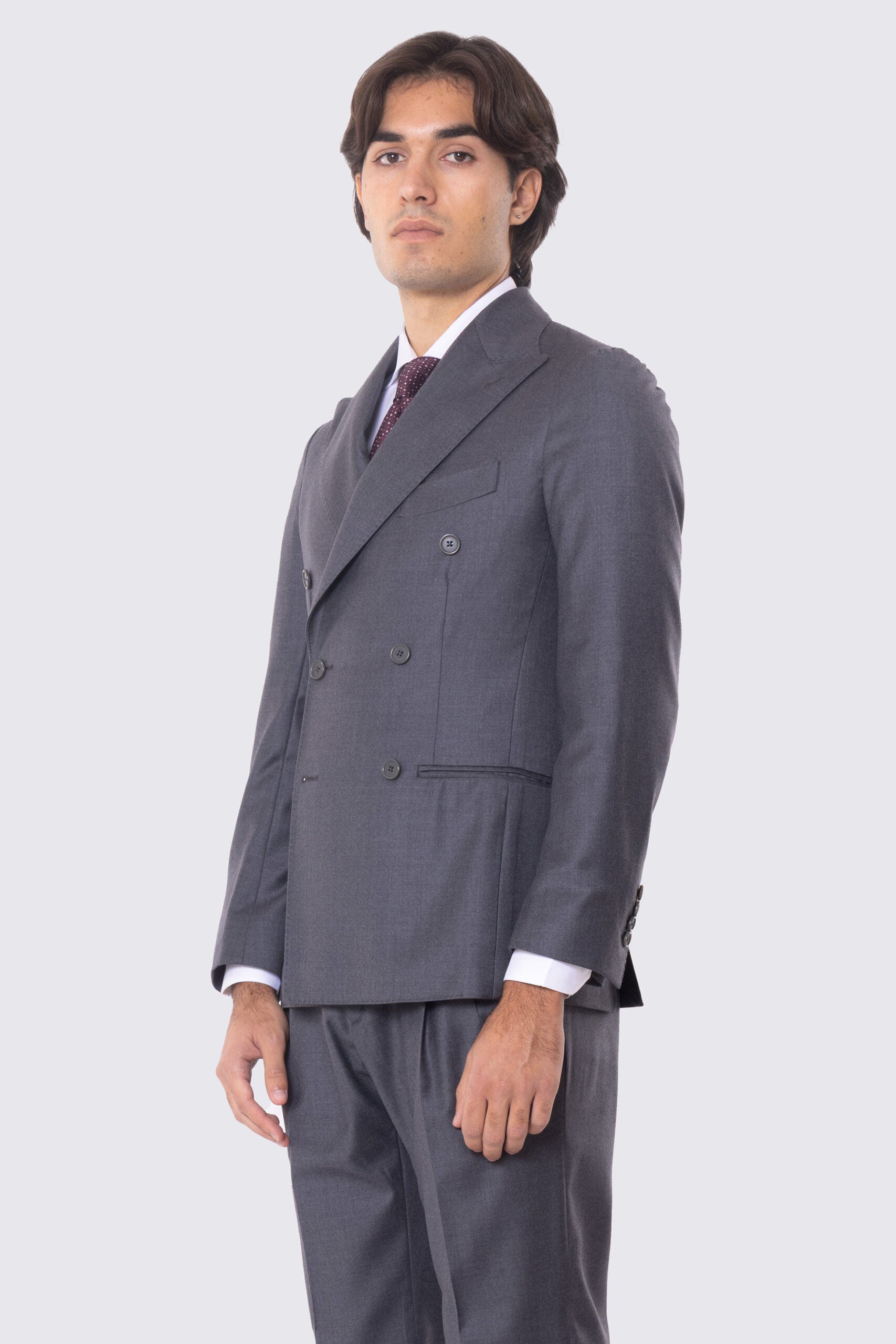 Abito grigio con giacca Doppiopetto rever a lancia tasche a filo e pantalone vita alta con doppia pinces e risvolto 5cm 100% lana Flanella Carillo Drapers