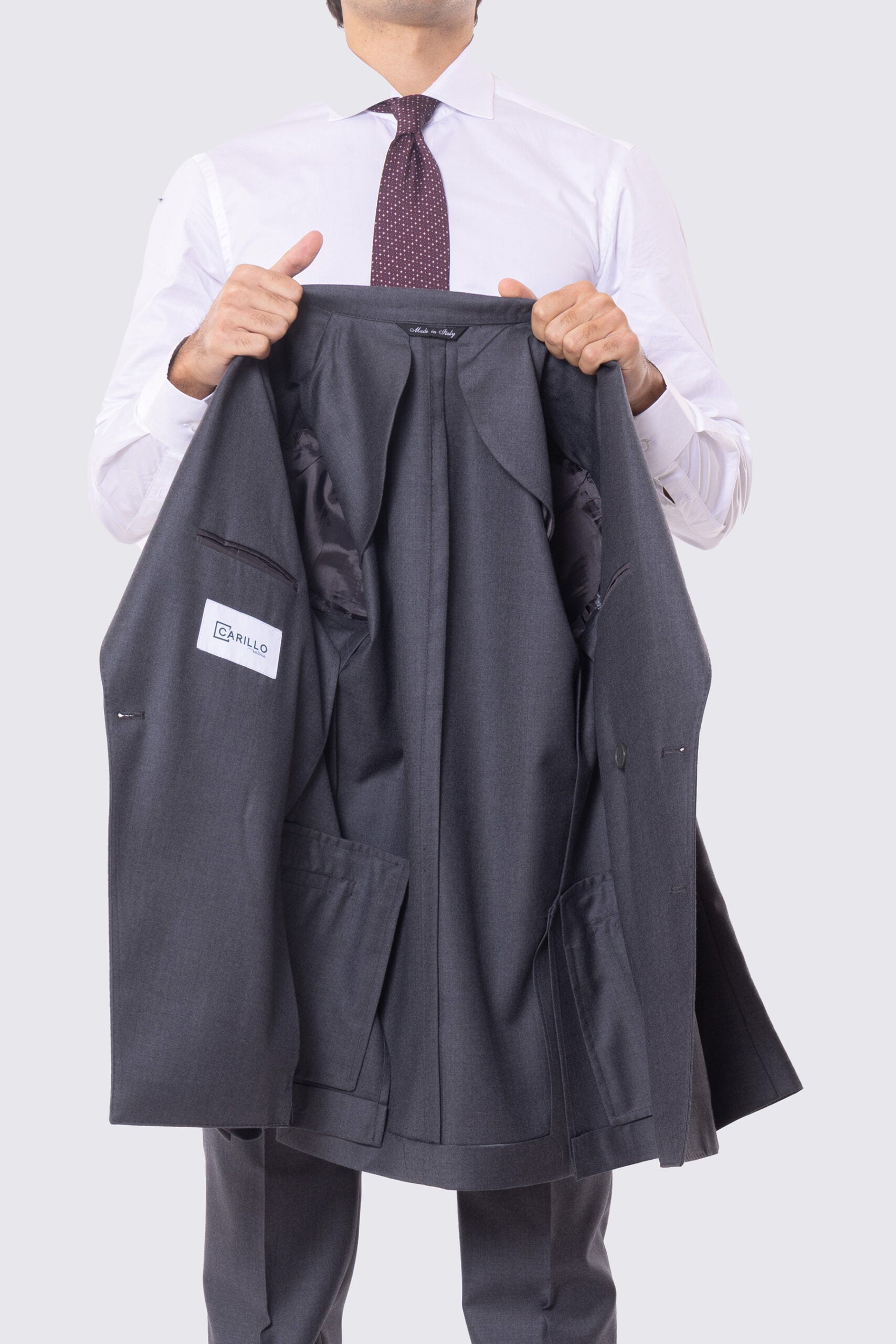 Abito grigio con giacca Doppiopetto rever a lancia tasche a filo e pantalone vita alta con doppia pinces e risvolto 5cm 100% lana Flanella Carillo Drapers