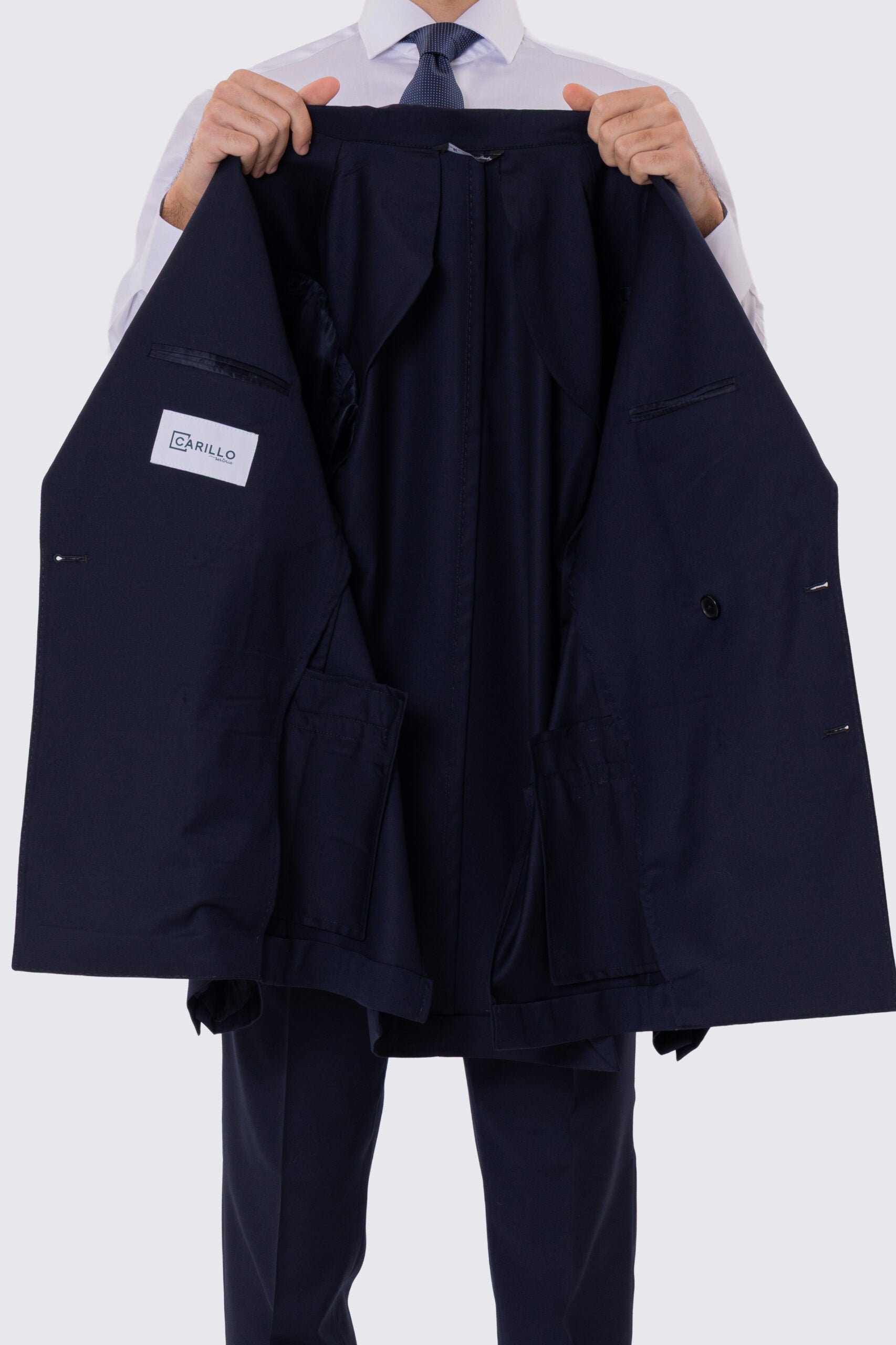 Abito uomo Doppiopetto blu notte fresco lana super 110's Tessuti in esclusiva Sartoria Carillo completamente sfoderato con Rever a lancia e tasche a filetto..