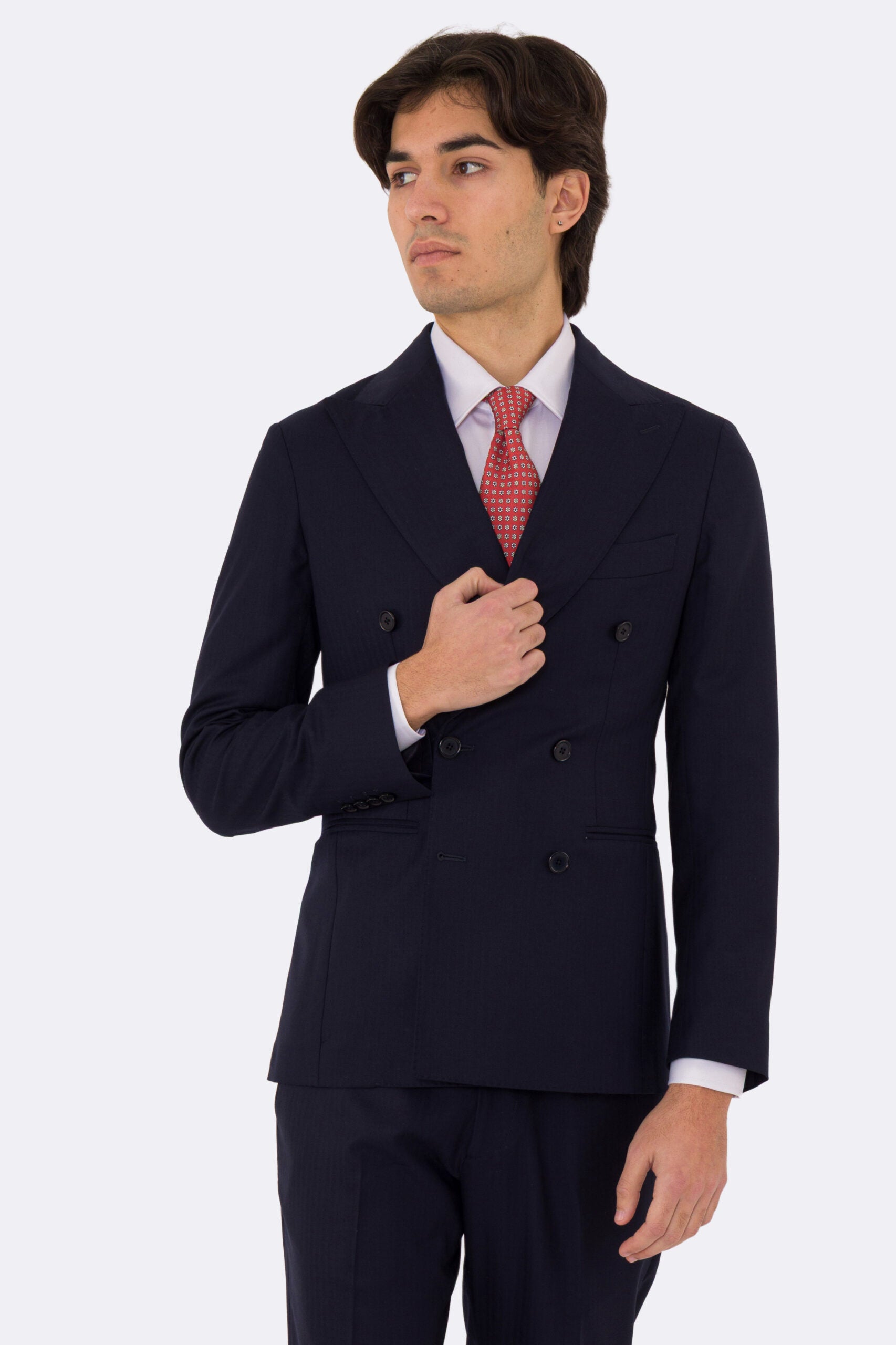 Abito uomo Doppiopetto Blu spigato fresco lana super 150's Tessuti in esclusiva Sartoria Carillo completamente sfoderato con Rever a lancia e tasche a filetto .