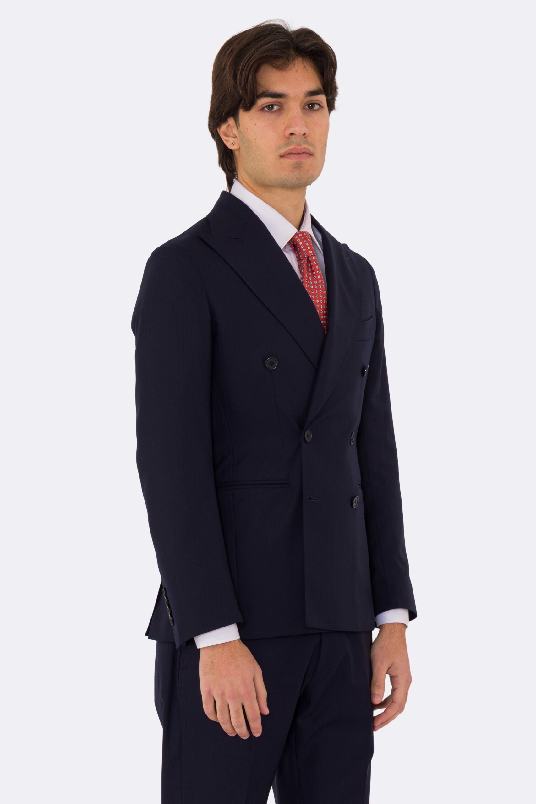 Abito uomo Doppiopetto Blu spigato fresco lana super 150's Tessuti in esclusiva Sartoria Carillo completamente sfoderato con Rever a lancia e tasche a filetto .