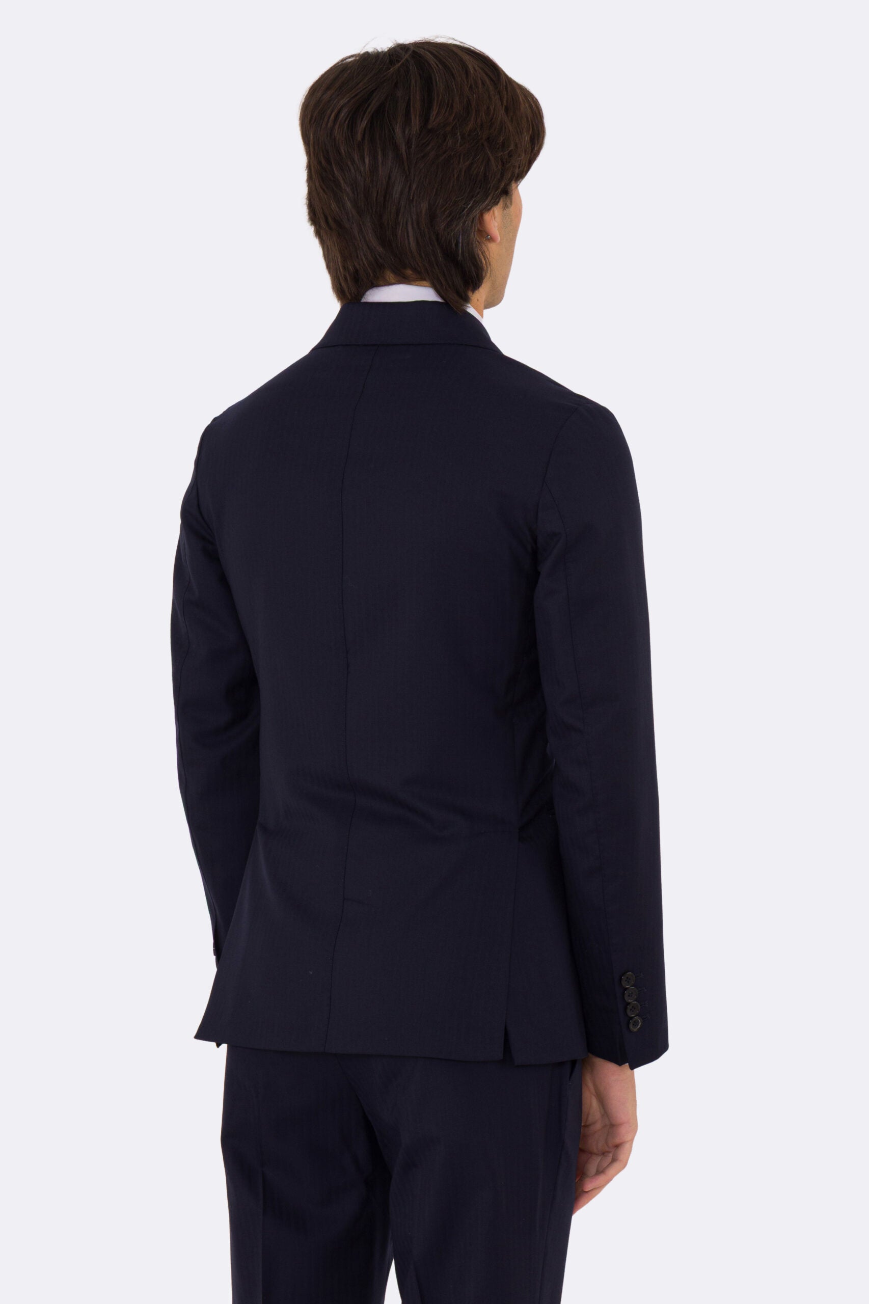 Abito uomo Doppiopetto Blu spigato fresco lana super 150's Tessuti in esclusiva Sartoria Carillo completamente sfoderato con Rever a lancia e tasche a filetto .