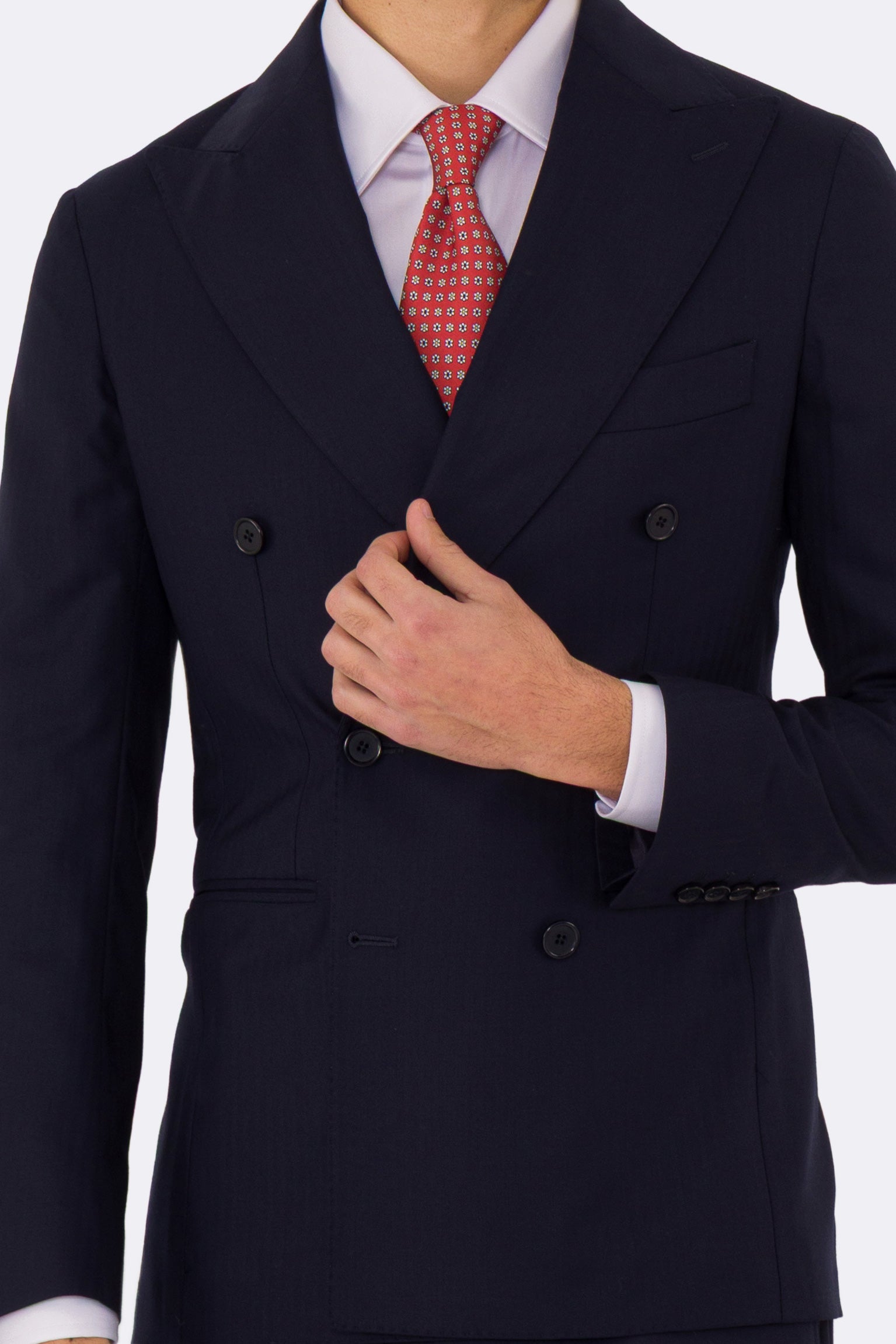 Abito uomo Doppiopetto Blu spigato fresco lana super 150's Tessuti in esclusiva Sartoria Carillo completamente sfoderato con Rever a lancia e tasche a filetto .