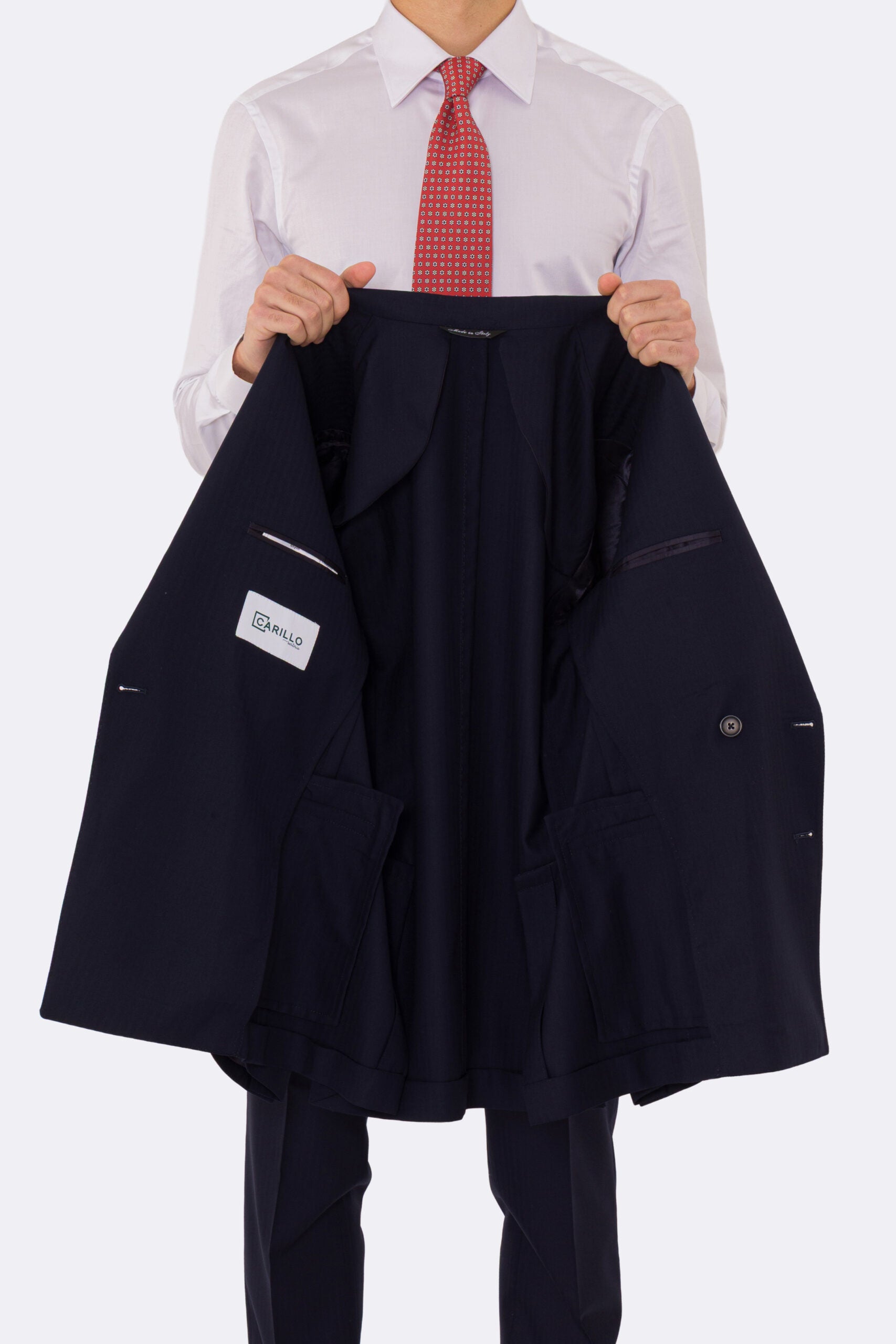 Abito uomo Doppiopetto Blu spigato fresco lana super 150's Tessuti in esclusiva Sartoria Carillo completamente sfoderato con Rever a lancia e tasche a filetto .