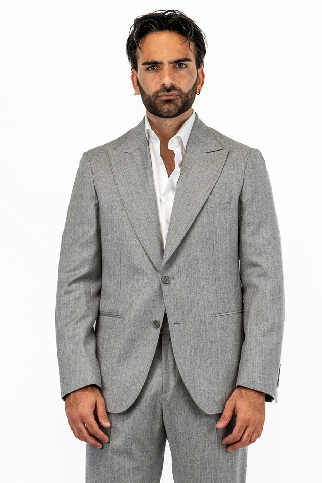 Abito da uomo Monopetto grigio chiaro in lana flanella Bristol tessuti napoli sfoderata Rever a lancia tasche a filo