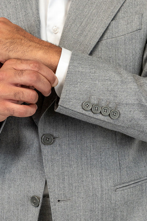 Abito da uomo Monopetto grigio chiaro in lana flanella Bristol tessuti napoli sfoderata Rever a lancia tasche a filo