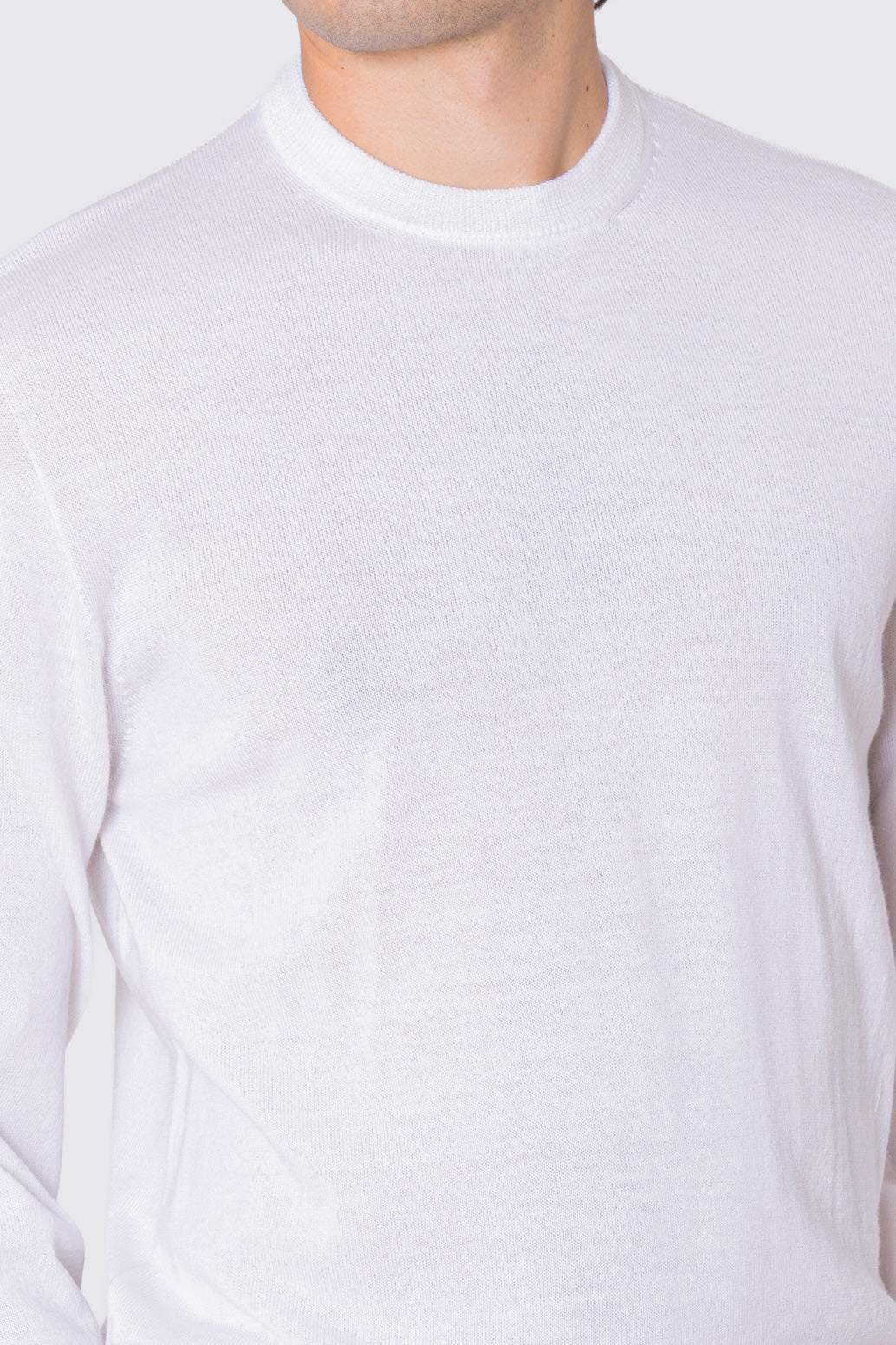 Maglione girocollo bianco in lana merinos 100% costruzione tubolare senza cuciture rifinito a mano tinta unita con elastici sulle maniche e sul fondo Finezza 12