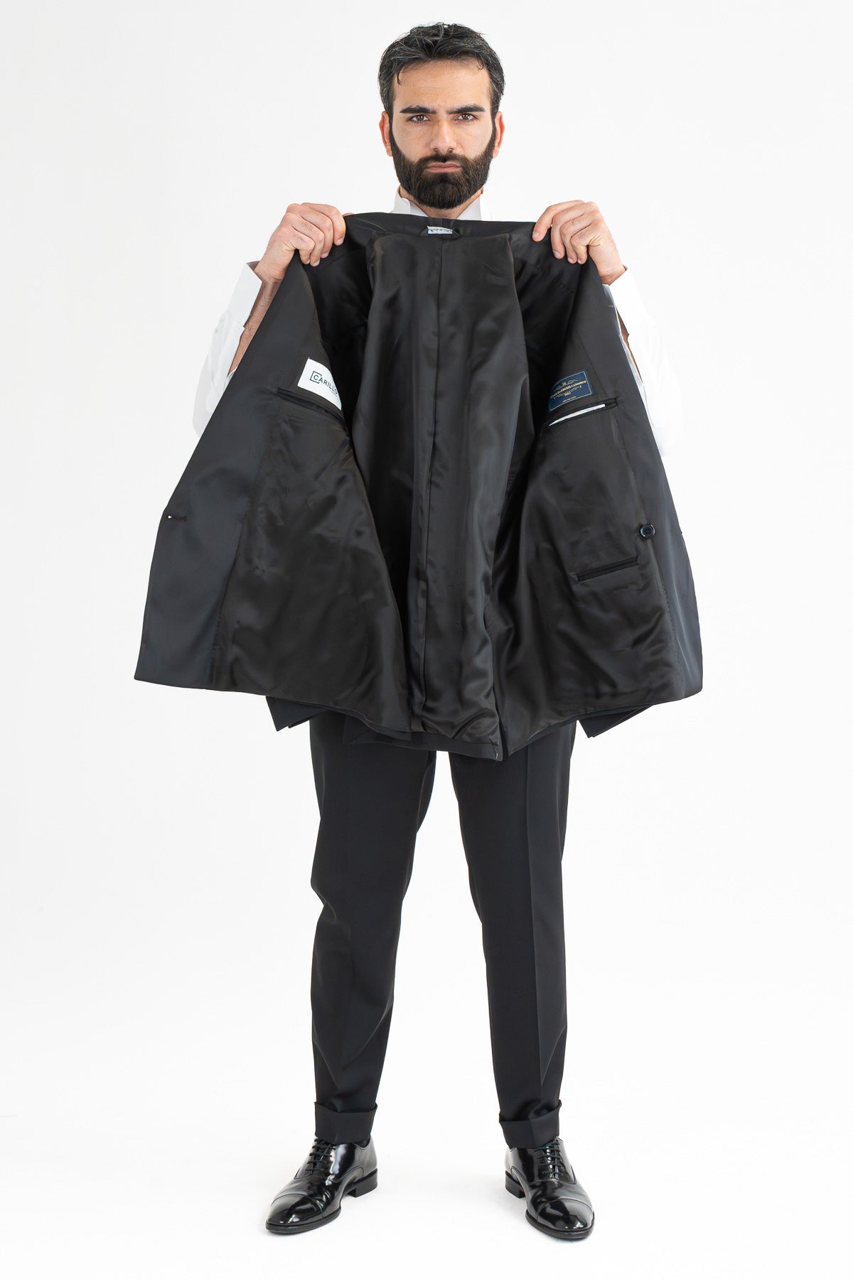 Abito smoking Doppiopetto nero da uomo in fresco lana super 130's Vitale Barberis Canonico con rever a scialle largo in raso con pantalone senza pinces