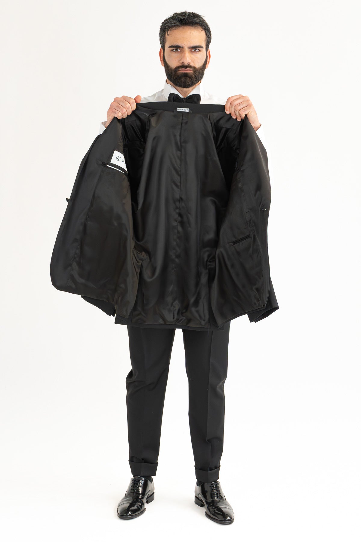 Abito smoking Monopetto nero da uomo in fresco lana super 130's Vitale Barberis Canonico con rever a lancia largo in raso con pantalone senza pinces