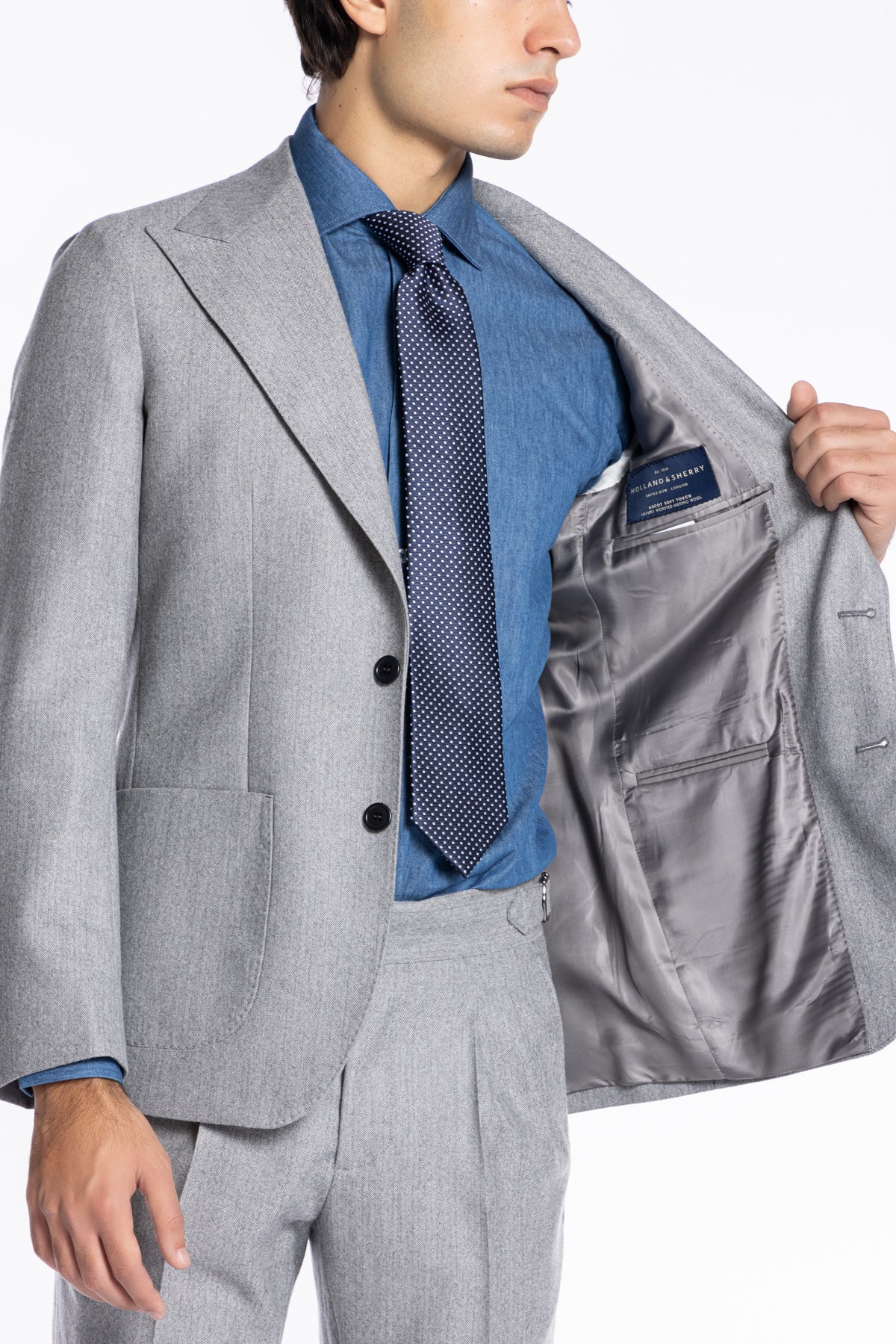 Giacca uomo monopetto grigio chiaro spigata in pura lana Rever a lancia e tasche a toppe Holland & Sherry
