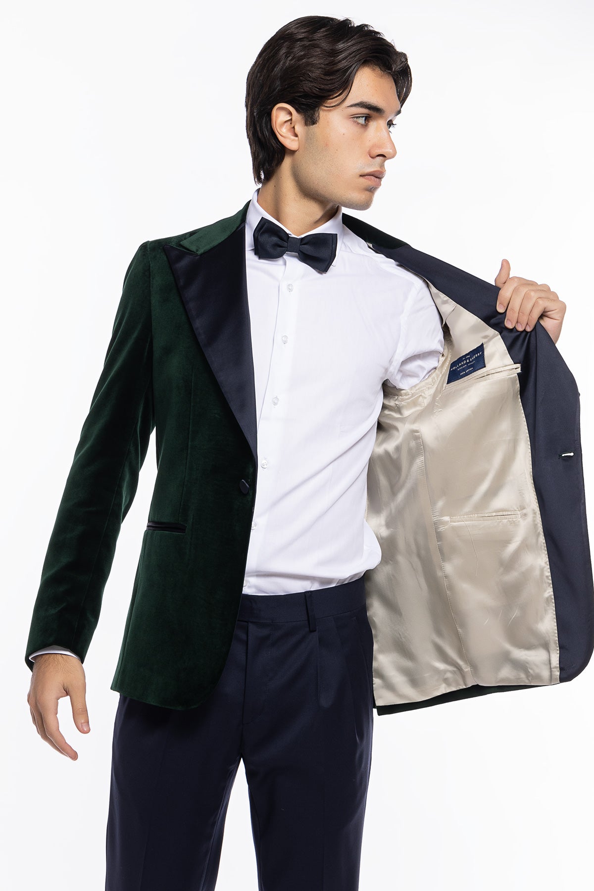 Giacca uomo monopetto verde bottiglia in velluto liscio Holland & Sherry con rever a lancia largo blu notte